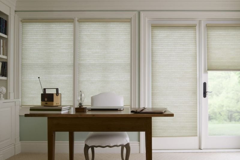 Cellular shades in modern office building with automated controls