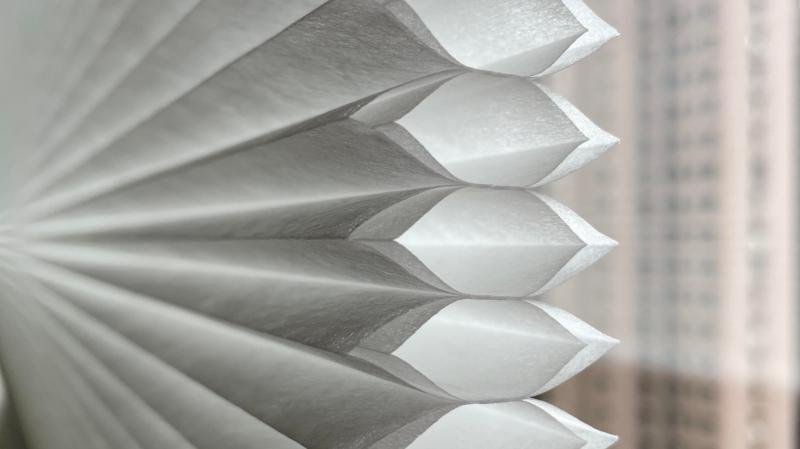Cell-in-cell cellular shade cross-section showing three honeycomb layers for maximum insulation