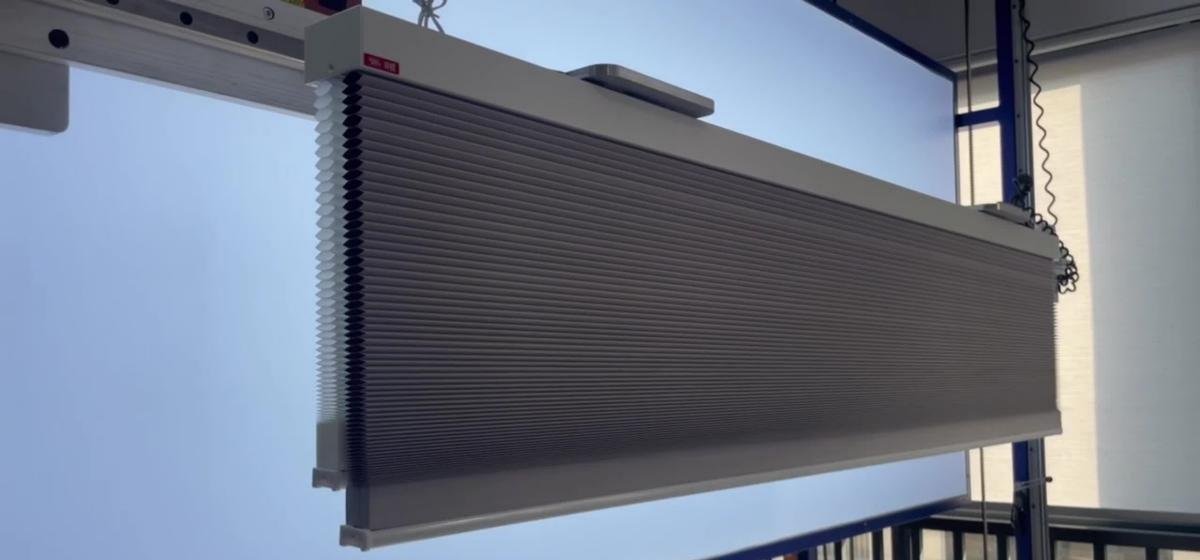 Close-up of Shadesmart window shade fabric weave and roller mechanism assembly detail