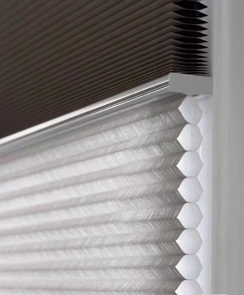 Shadesmart cellular shade fabric detail -- honeycomb cell structure visible through translucent light-filtering material