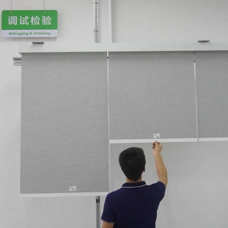 Shadesmart production director reviewing assembly at a factory workstation