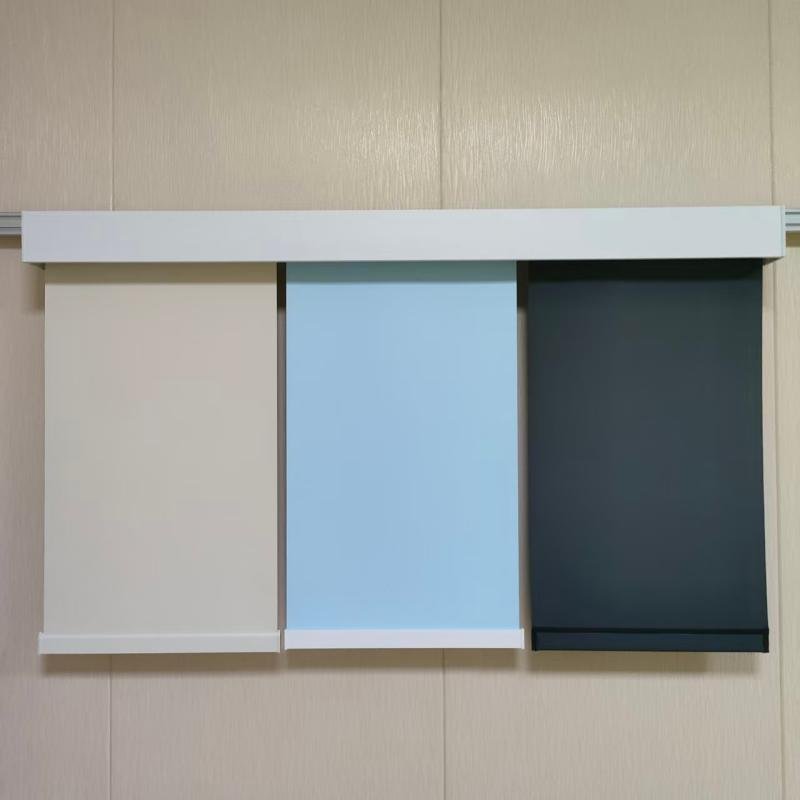 Three roller shade fabric panels from different dye lots hung side by side in daylight, showing a visible color difference at &Delta;E 2.8